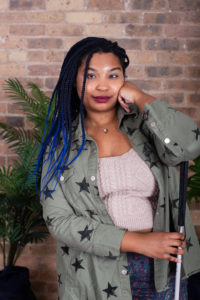 Headshot of Janay, a medium-toned Black woman